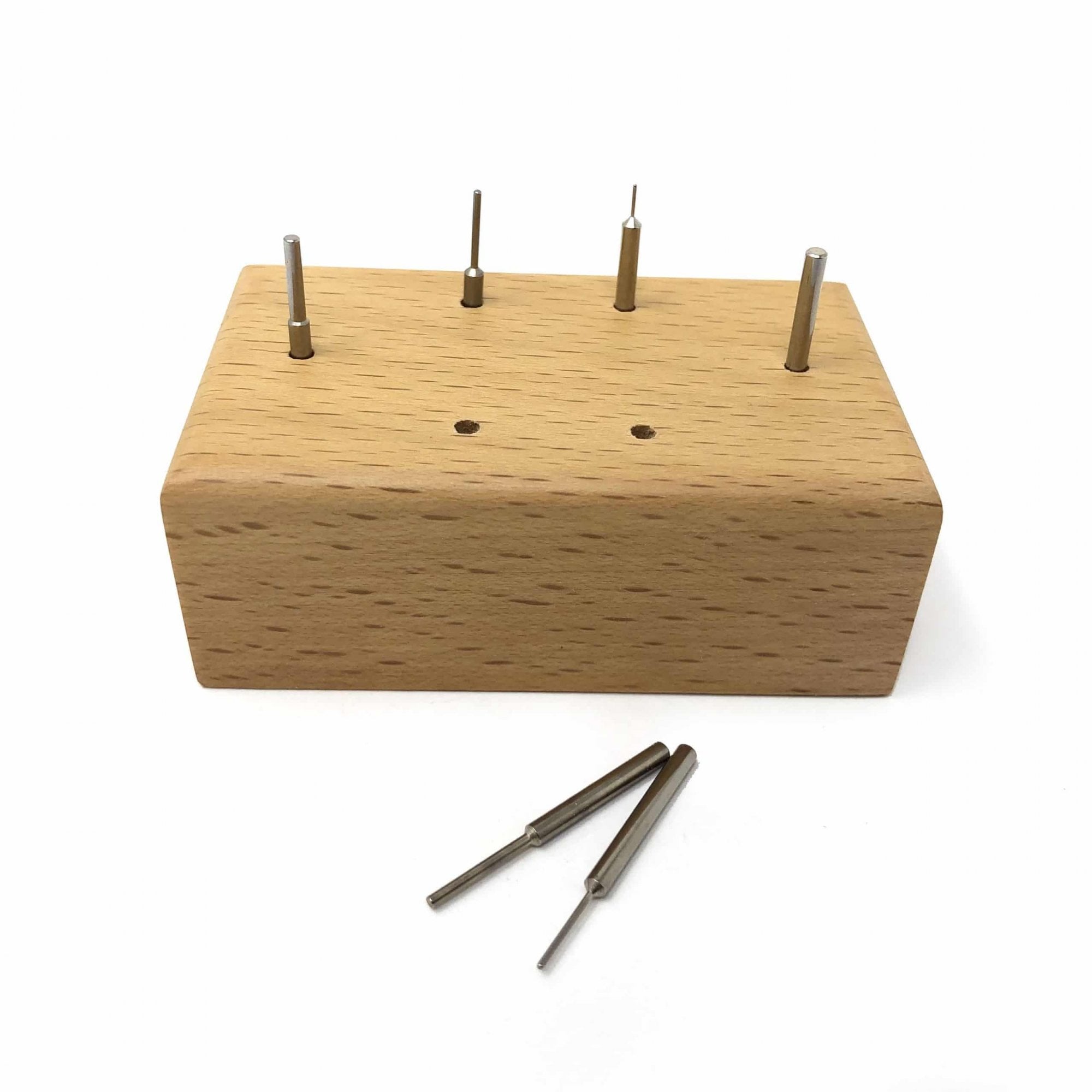Watch Link Removing Pins on Wooden Stand