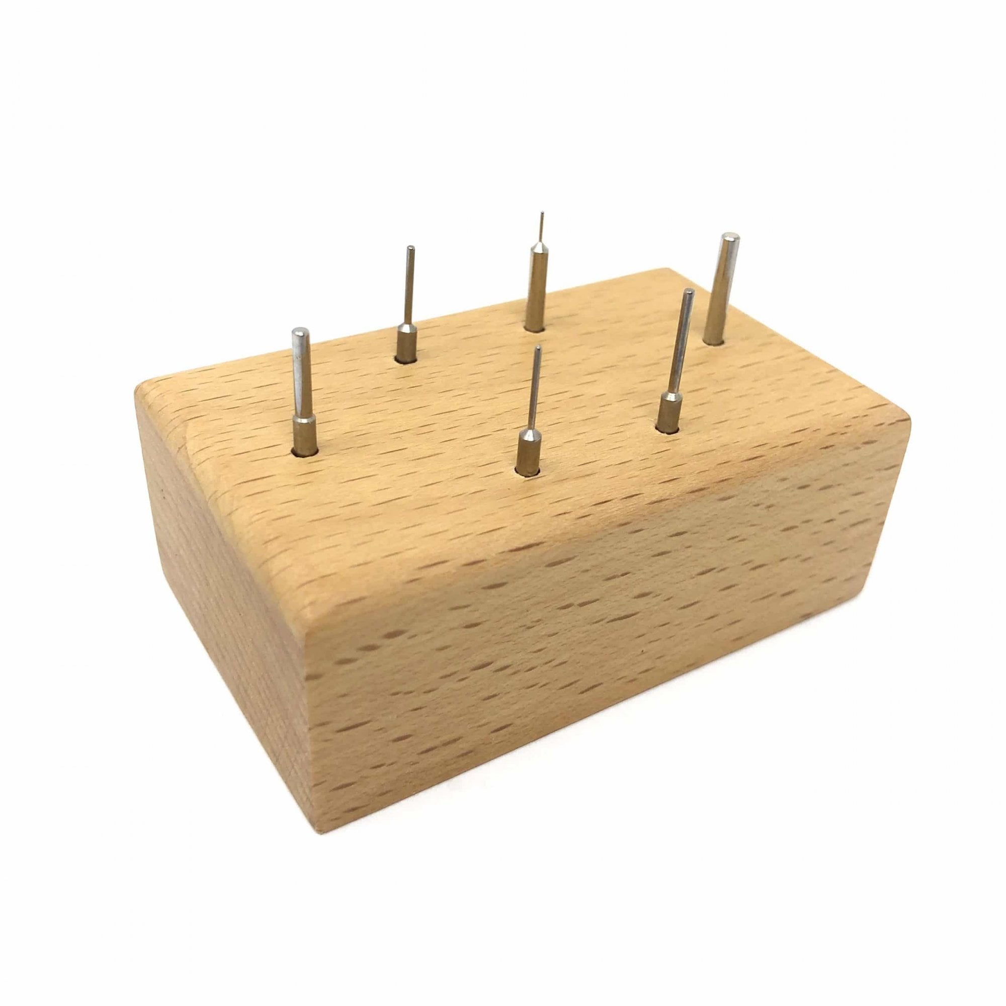 Watch Link Removing Pins on Wooden Stand